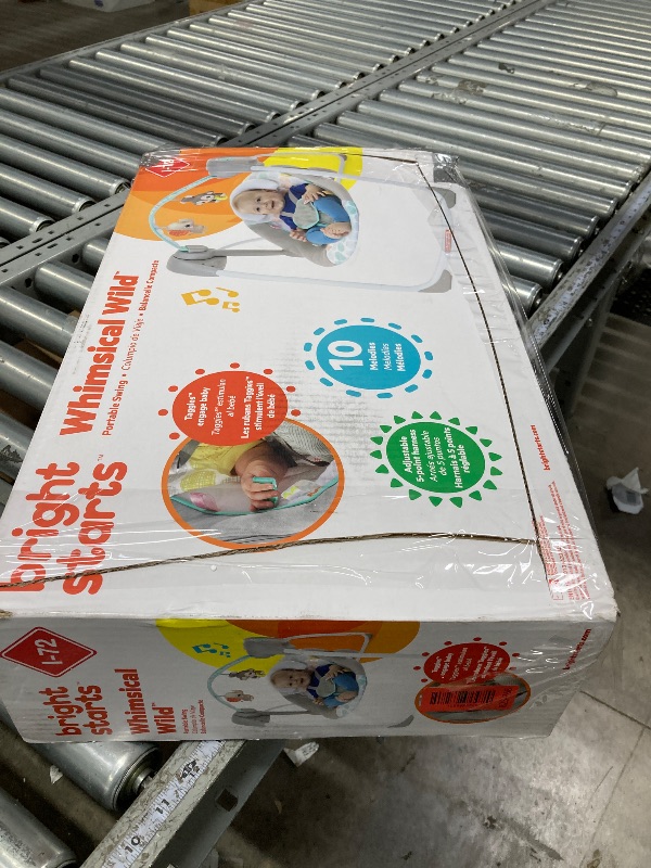 Photo 1 of ****It is used and is missing parts and it is not known if it works at 100%.***Bright Starts Portable Automatic 6-Speed Baby Swing with Adaptable Speed, Taggies, Music, Removable-Toy-Bar, 0-9 Months 6-20 lbs (Whimsical Wild)