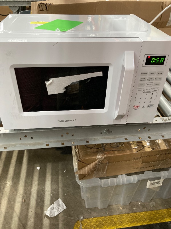 Photo 1 of  0.7 Cu Ft Microwave with 10 Power Levels, 700W Microwave with Digital Display, Countertop Microwave with Child Safety Door Lock, Programmable with Push Button, White