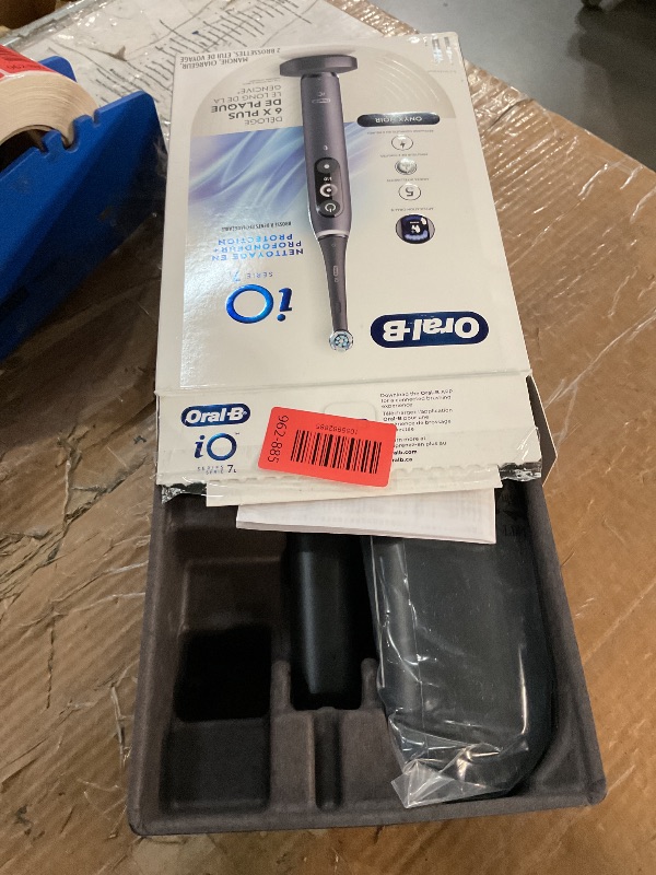 Photo 1 of Oral-B iO Deep Clean + Protect Rechargeable Electric Toothbrush, Black with a iO Series 7 Toothbrush, 2 Replacement Brush Heads, and a Charging Travel Case