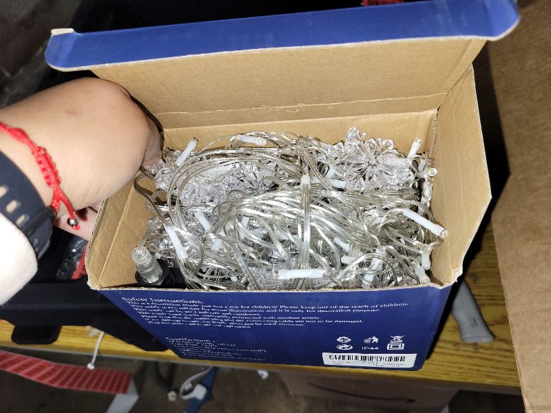 Photo 1 of 150 LED Christmas Icicle Lights with Snowflakes, Hanging Snowflake Light with 8 Modes, Connectable Warm White Icicle Lights for Outside, Roof, Window, Holiday Party Decor