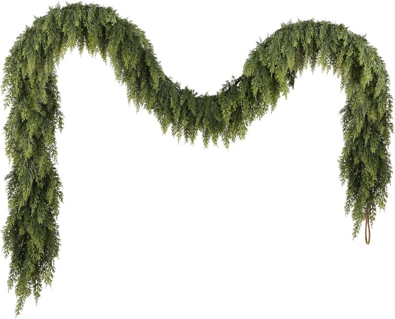 Photo 1 of N&T NIETING 9ft Christmas Cedar Garland with Realistic Soft Thickness Pine, Artificial Green Faux Cedar Pine Garland for Fireplace Mantle Fireplace Indoor Outdoor Holiday Party Home Decoration