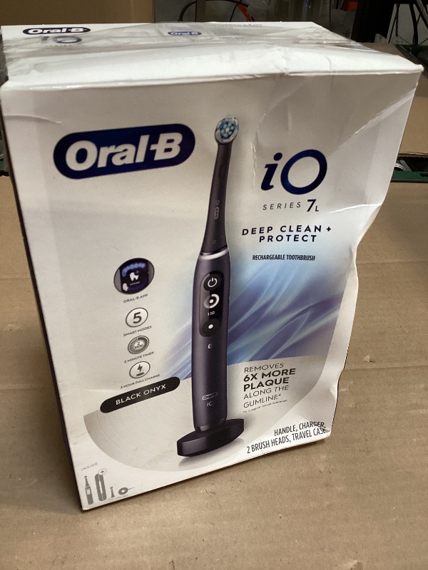 Photo 1 of Oral-B iO Deep Clean + Protect Rechargeable Electric Toothbrush, Black with a iO Series 7 Toothbrush, 2 Replacement Brush Heads, and a Charging Travel Case