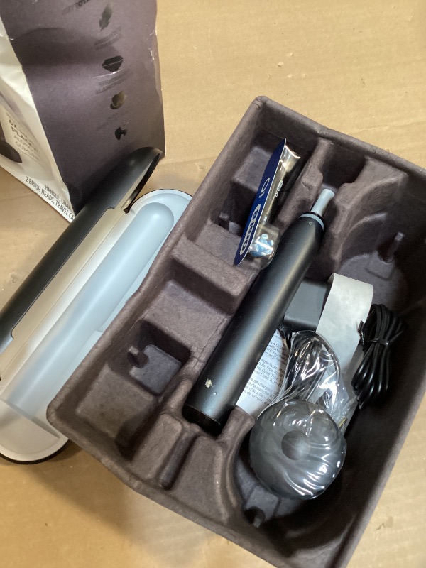 Photo 1 of Oral-B iO Deep Clean + Protect Rechargeable Electric Toothbrush, Black with a iO Series 7 Toothbrush, 2 Replacement Brush Heads, and a Charging Travel Case