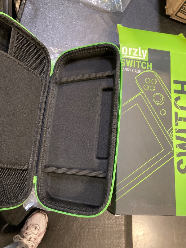 Photo 1 of Orzly Carrying case for Nintendo Switch OLED and Switch Console - Green Protective Hard Portable Travel case Shell Pouch for Nintendo Switch Console & Accessories