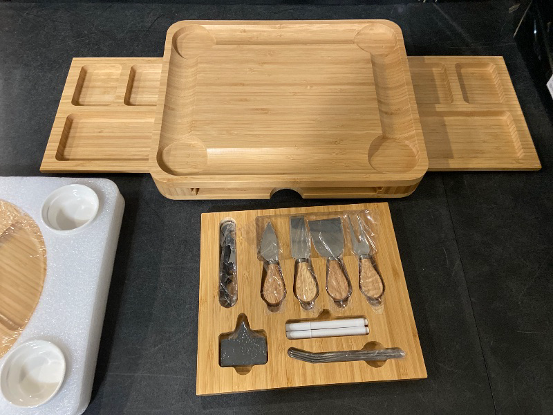 Photo 1 of Charcuterie Board with Lid – Large Bamboo Cheese Board Set with Utensils & Drawers – Housewarming, Wedding Gifts for Couples, Serving Tray with Cover (Cream)
