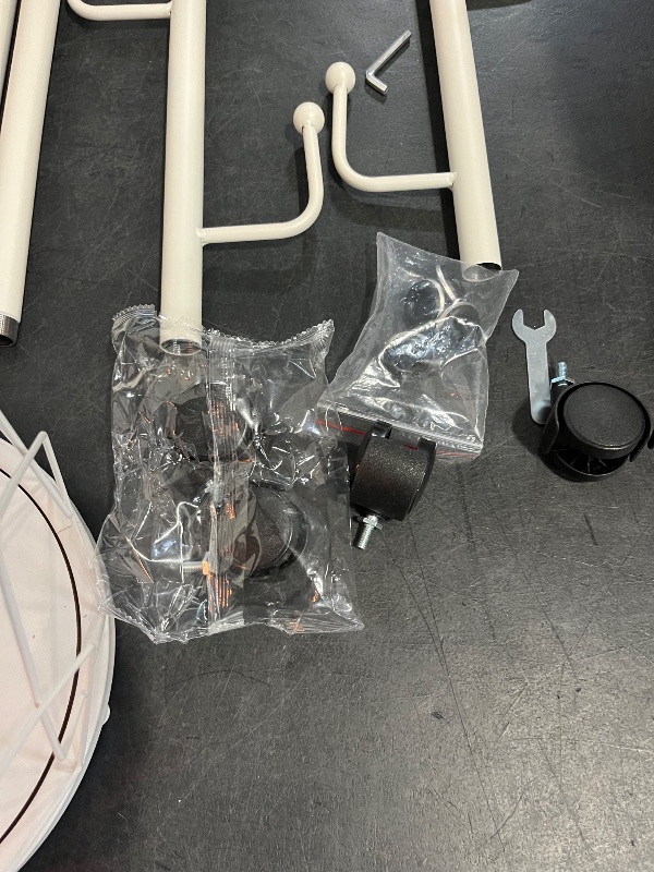 Photo 1 of Freestanding Metal Coat Rack Stand with Basket Modern Organizer for Scarf Jacket Hat Bags Ideal for Home Entryway Bedroom Corner Stable and Moveable Tree
