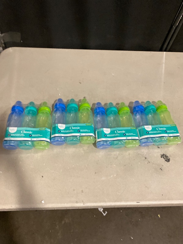 Photo 1 of Evenflo Feeding Classic Tinted Plastic Standard Neck Bottles for Baby, Infant and Newborn - Teal/Green/Blue, 8 Ounce (Pack of 12)