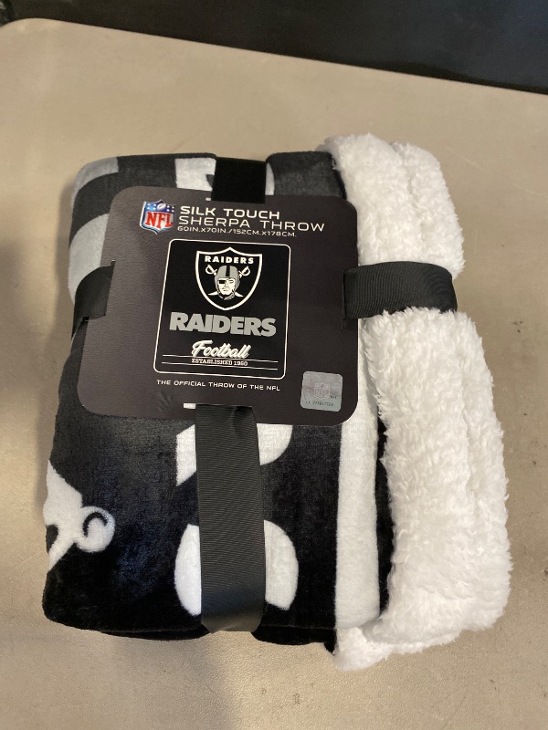 Photo 1 of  Raiders NFL "Silk Touch" Sherpa Throw Blanket