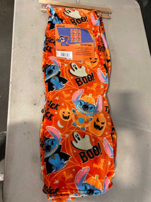 Photo 1 of  Disney Lilo & Stitch "Stitch Tricks" 50x70 Halloween Silk Touch throw blanket. 