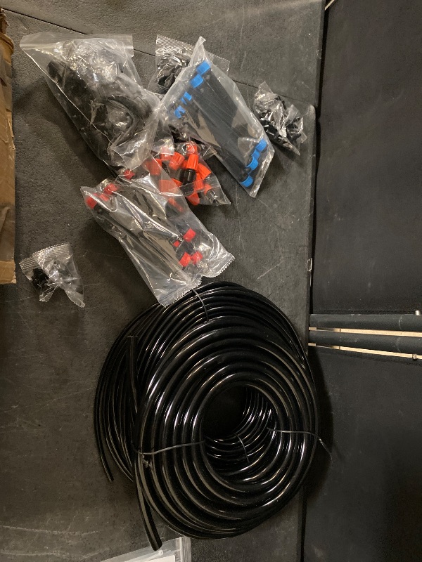 Photo 1 of Drip Irrigation Kit, 100FT Garden Watering System Automatic Irrigation Equipment with 1/4 inch & 3/8 inch Blank Distribution Tubing, DIY Greenhouse Micro Drip Irrigation Kit for Garden, Greenhouse, Flower Bed, Lawn