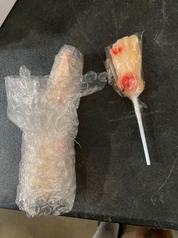 Photo 1 of Halloween Body Parts Candy, Individually Wrapped Lollipops, Trick or Treat Candies and Goodie Bag Fillers, 12 Count