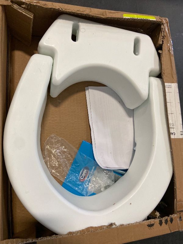 Photo 1 of Carex Hinged Round Raised Toilet Seat Riser, Adds 3.5 Inches of Height, 300 lbs Capacity, Elevating and Raising Seat for Elderly and Handicap, Universal, Slip-Resistant, White.