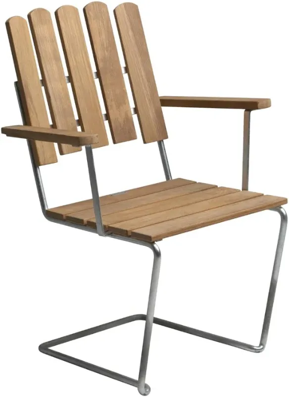 Photo 1 of The seat and back are solid untreated teak — left to weather naturally to silver-grey over time, or maintained with oil if you prefer warmth. The base is hot-galvanized steel: unglamorous, indestructible, and honest about what outdoor furniture is actuall