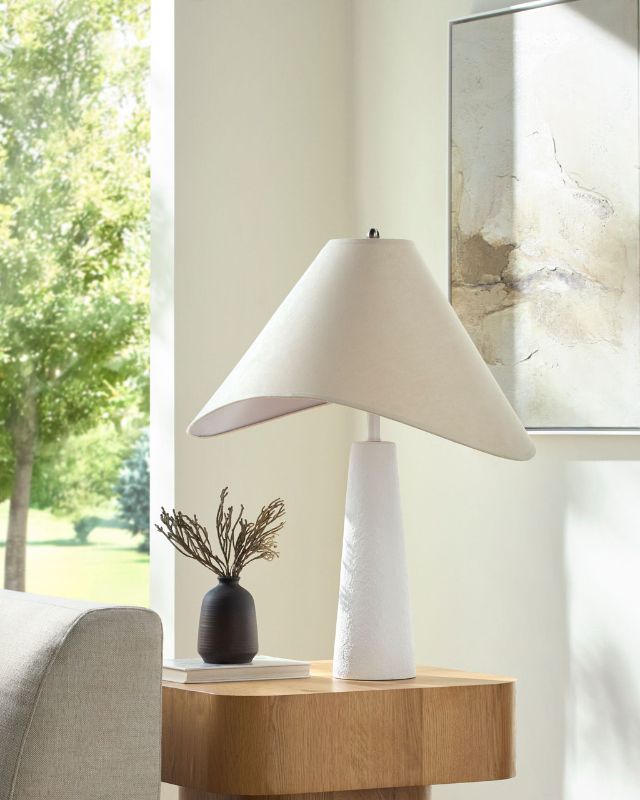 Photo 1 of Introducing the Apuila accent table lamp, a stunning fusion of arts & crafts tradition and modern design. Hand-painted masterpiece boasts a concrete body that exudes an earthy charm, complemented by a beautifully crafted polyester shade