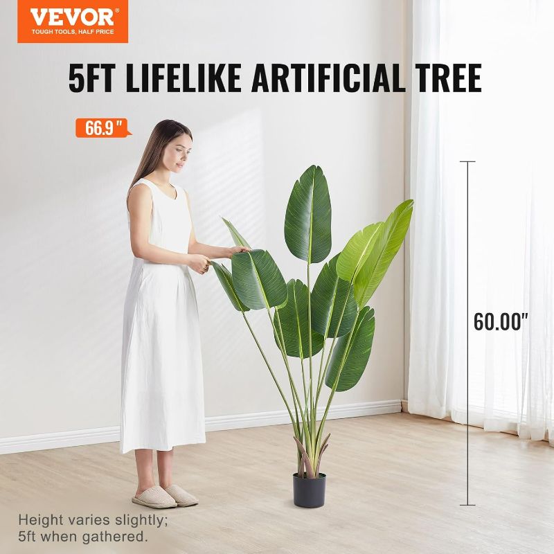 View 2 of Artificial Bird of Paradise Tree, 5 FT Tall Faux Plant, PE Material & Anti-Tip Tilt Protection Low-Maintenance Plant, Lifelike Green Fake Tree for Home Office Warehouse Decor Indoor Outdoor