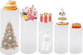 Photo 1 of Acrylic Cylinder Clear Pedestal Stands, 5PCS Round Cylinder Pedestal Display Plinth Pillars for Wedding Birthday Party Art Decor 23.6''(L),21.6''(M),19.7''(S