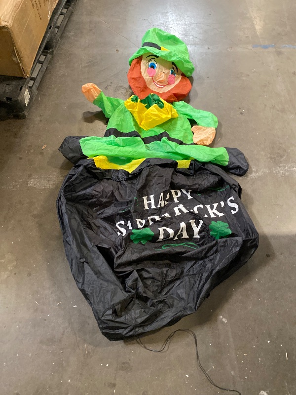 Photo 1 of 6 FT St. Patrick's Day Inflatable Leprechaun, Blow up Leprechaun Sits on Cornucopia Outdoor Decoration with LED Lights, for Yard Garden Lawn Front Door Holiday Decor (6FT Leprechaun on Cornucopia)