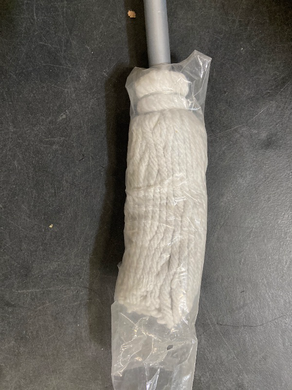 Photo 1 of cotton string mop, often referred to as a "deck mop"