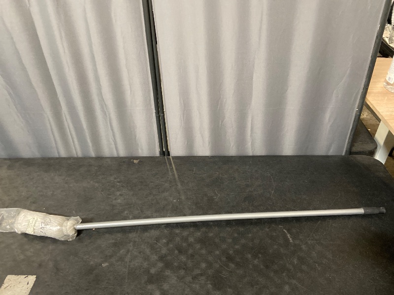 Photo 1 of cotton string mop, often referred to as a "deck mop"