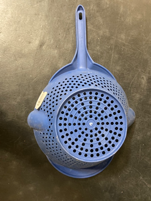 Photo 1 of Blue plastic vegetable strainer it has two pour sides and two-hole sizes to drain