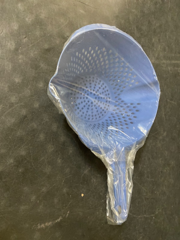 Photo 1 of Blue plastic vegetable strainer it has two pour sides and two-hole sizes to drain