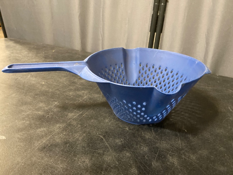 Photo 1 of Blue plastic vegetable strainer it has two pour sides and two-hole sizes to drain