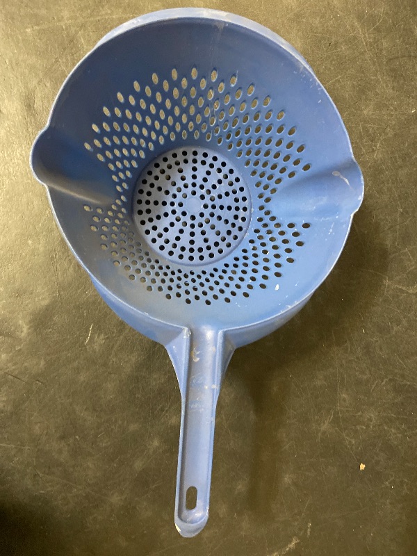 Photo 1 of Blue plastic vegetable strainer it has two pour sides and two-hole sizes to drain