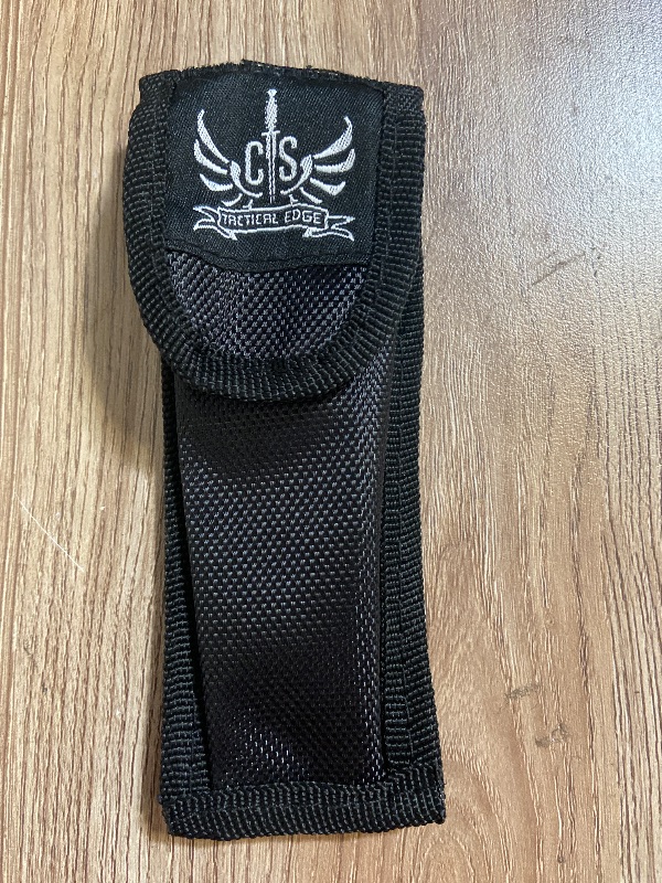 Photo 1 of Black CTS Tactical Edge nylon sheath features a secure snap closure for holding small tools or folding knives.