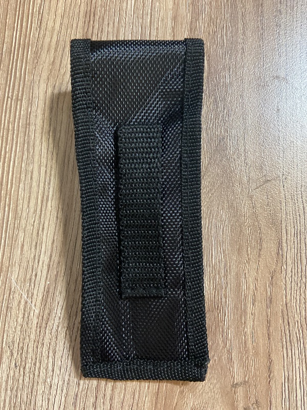 Photo 1 of Black CTS Tactical Edge nylon sheath features a secure snap closure for holding small tools or folding knives.