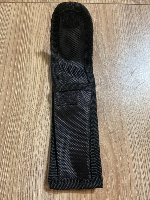 Photo 1 of Black CTS Tactical Edge nylon sheath features a secure snap closure for holding small tools or folding knives.