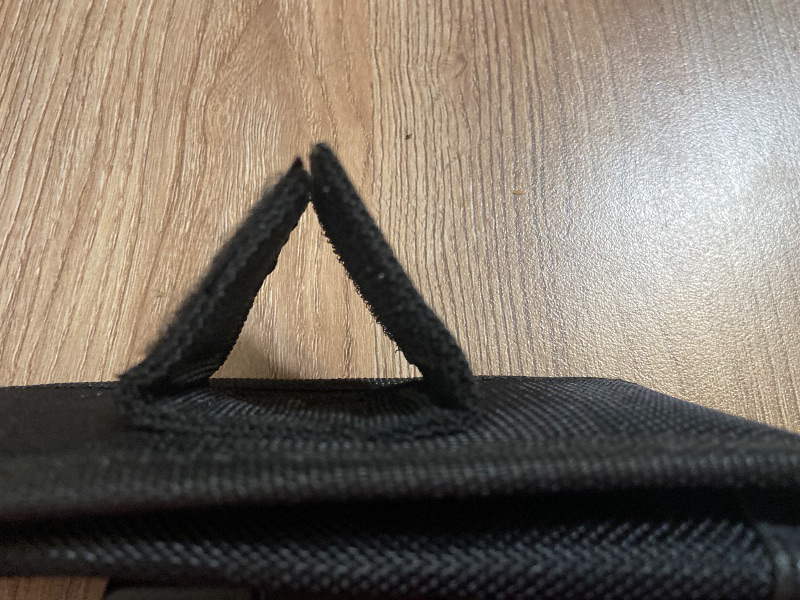 View 4 of Tactical black nylon pouch features a secure plastic buckle closure for carrying items like tools or accessories