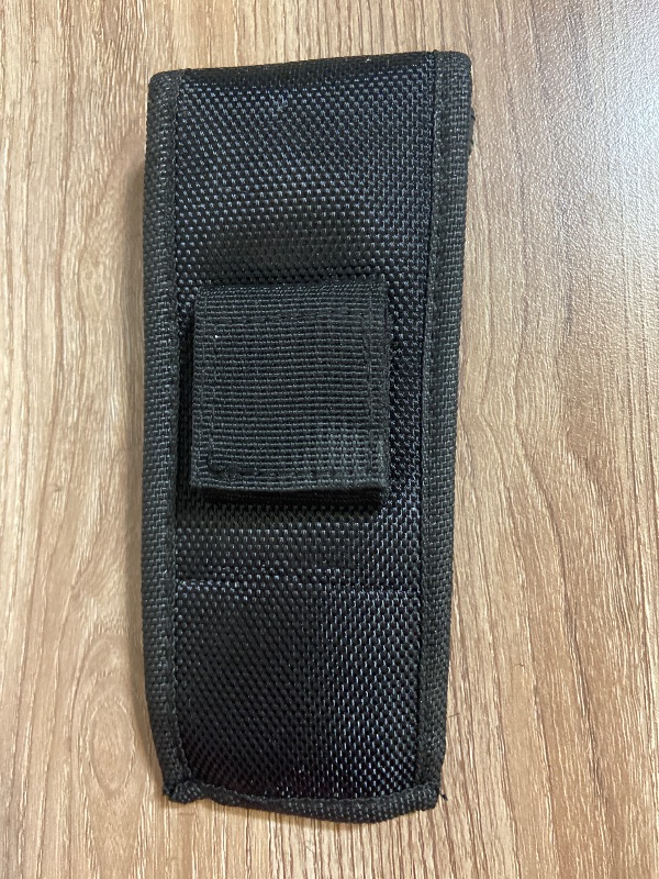 View 5 of Tactical black nylon pouch features a secure plastic buckle closure for carrying items like tools or accessories