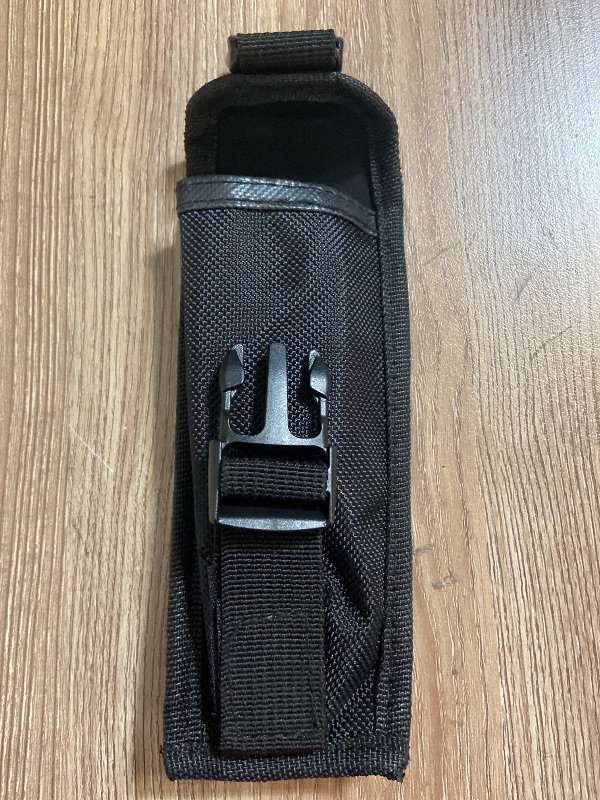 View 3 of Tactical black nylon pouch features a secure plastic buckle closure for carrying items like tools or accessories