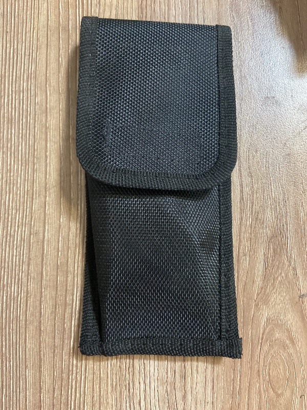 View 2 of Black tactical pouch resembles a Galls molded nylon holder typically used for pepper spray and utility pouches
