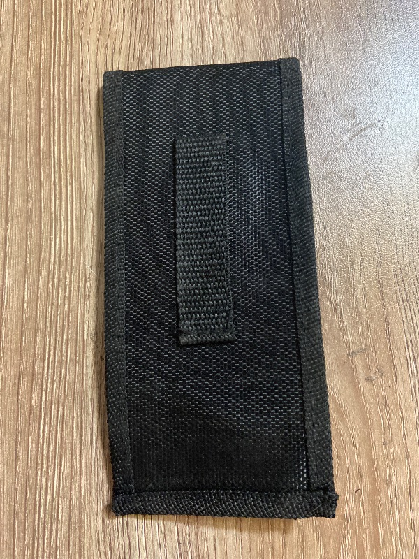 View 4 of Black tactical pouch resembles a Galls molded nylon holder typically used for pepper spray and utility pouches