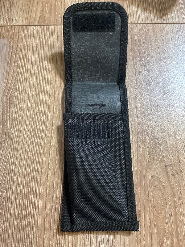 View 3 of Black tactical pouch resembles a Galls molded nylon holder typically used for pepper spray and utility pouches