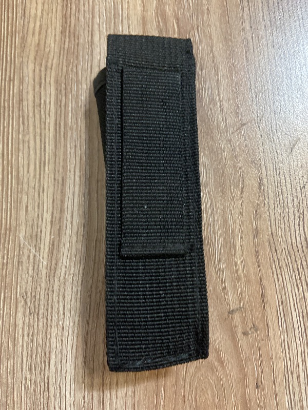 Photo 1 of Black nylon sheath typically designed for a folding knife or multi-tool