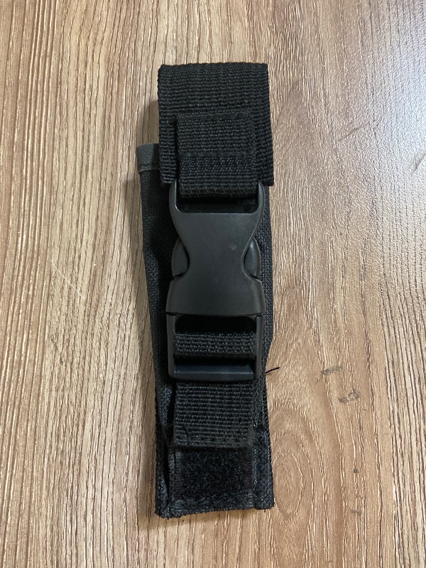Photo 1 of *6in Black tactical nylon sheath featuring a plastic quick-release buckle and Velcro closures for securing a knife or tool