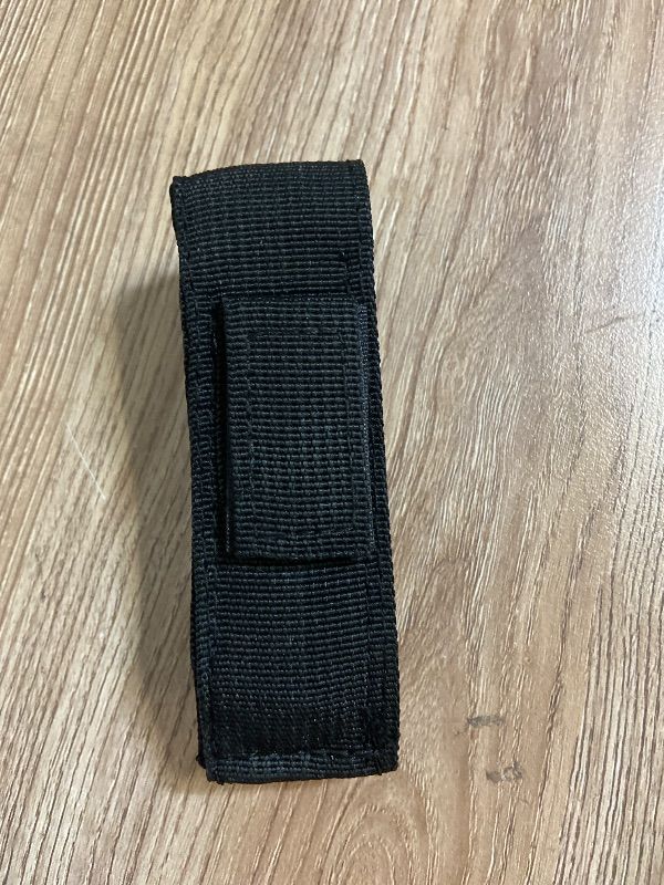 View 3 of *4.5in 2PK Black tactical pouch, often used as a sheath for Out-the-Front (OTF) automatic knives or similar tools.