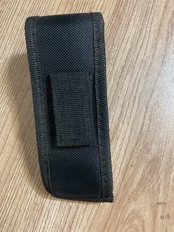 Photo 1 of *5in black nylon tactical pouch features a quick-release plastic buckle for secure closure.