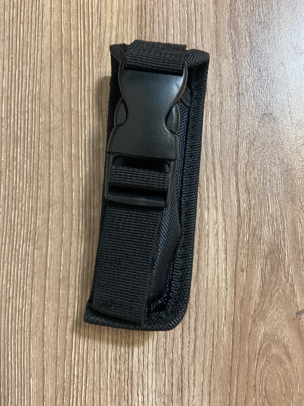 Photo 1 of *5in black nylon tactical pouch features a quick-release plastic buckle for secure closure.