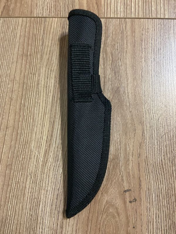 Photo 1 of *8in Hunter Outdoors branded sheath is constructed from durable black nylon material.