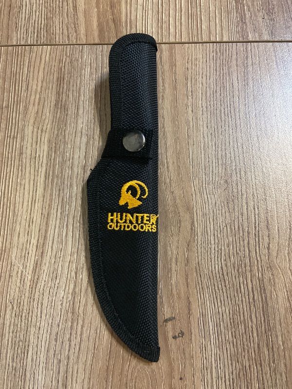 Photo 1 of *8in Hunter Outdoors branded sheath is constructed from durable black nylon material.
