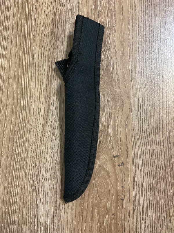 Photo 1 of *8in Generic black nylon sheath designed for a straight or fixed-blade knife.