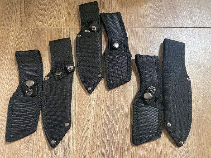 Photo 1 of 6 pack universal black nylon sheaths for fixed-blade knives, often sold for outdoor activities like hunting, camping, or survival.