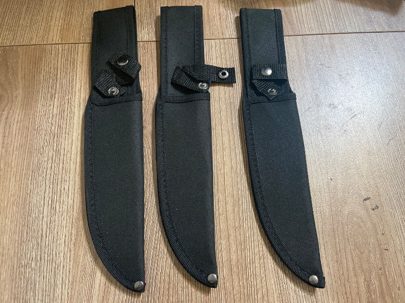 Photo 1 of 3pk black nylon sheaths designed for fixed-blade knives.