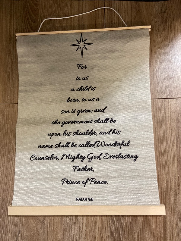 Photo 1 of Canvas wall hanging features the Christian Bible verse Isaiah 9:6 formatted to resemble a Christmas tree.
