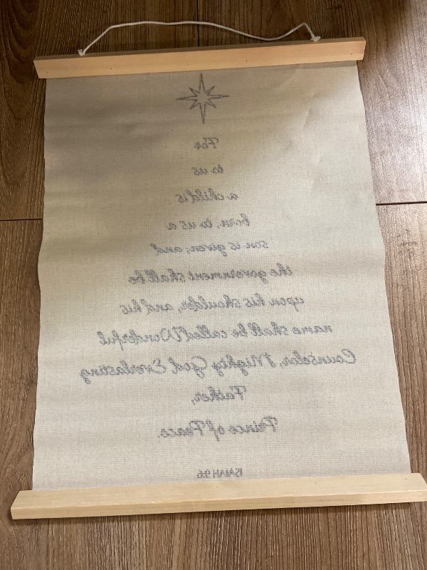 Photo 1 of Canvas wall hanging features the Christian Bible verse Isaiah 9:6 formatted to resemble a Christmas tree.
