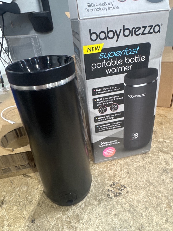 Photo 1 of ***(PARTS ONLY/ MAJOR DAMAGE/ NON FUNCTIONAL)***Baby Brezza Portable Warmer – 67% Faster Baby Bottle Warming - Travel Breastmilk and Formula Warmer - Safe, Even Heating - Up to 9oz - No Adapters, Black