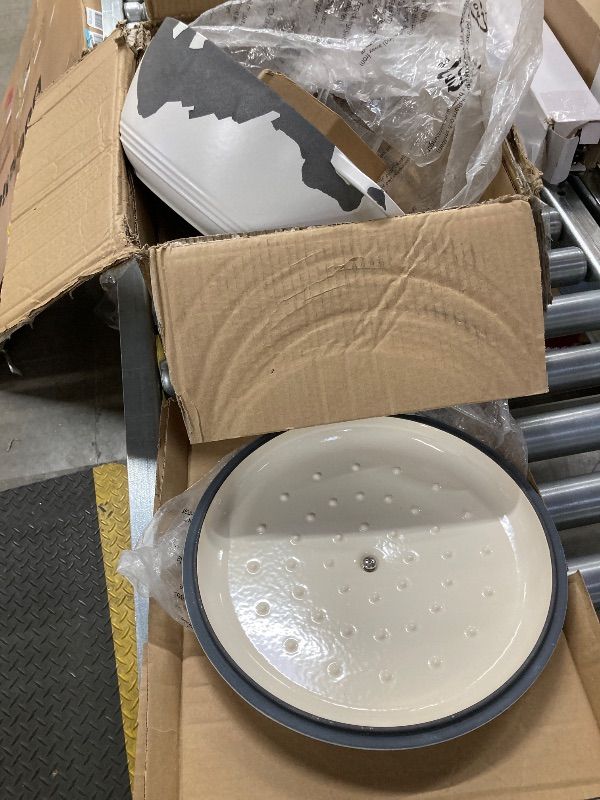 Photo 1 of ***DAMAGED -TOP COAT PEELED OFF -SELLING AS IS *** Amazon Basics Enameled Cast Iron Dutch Oven Pot with Lid, Round, Dual Handles, Heavy-Duty, Oven Safe for Stews, Roasting, Baking, 7.3-Quart, Matte White